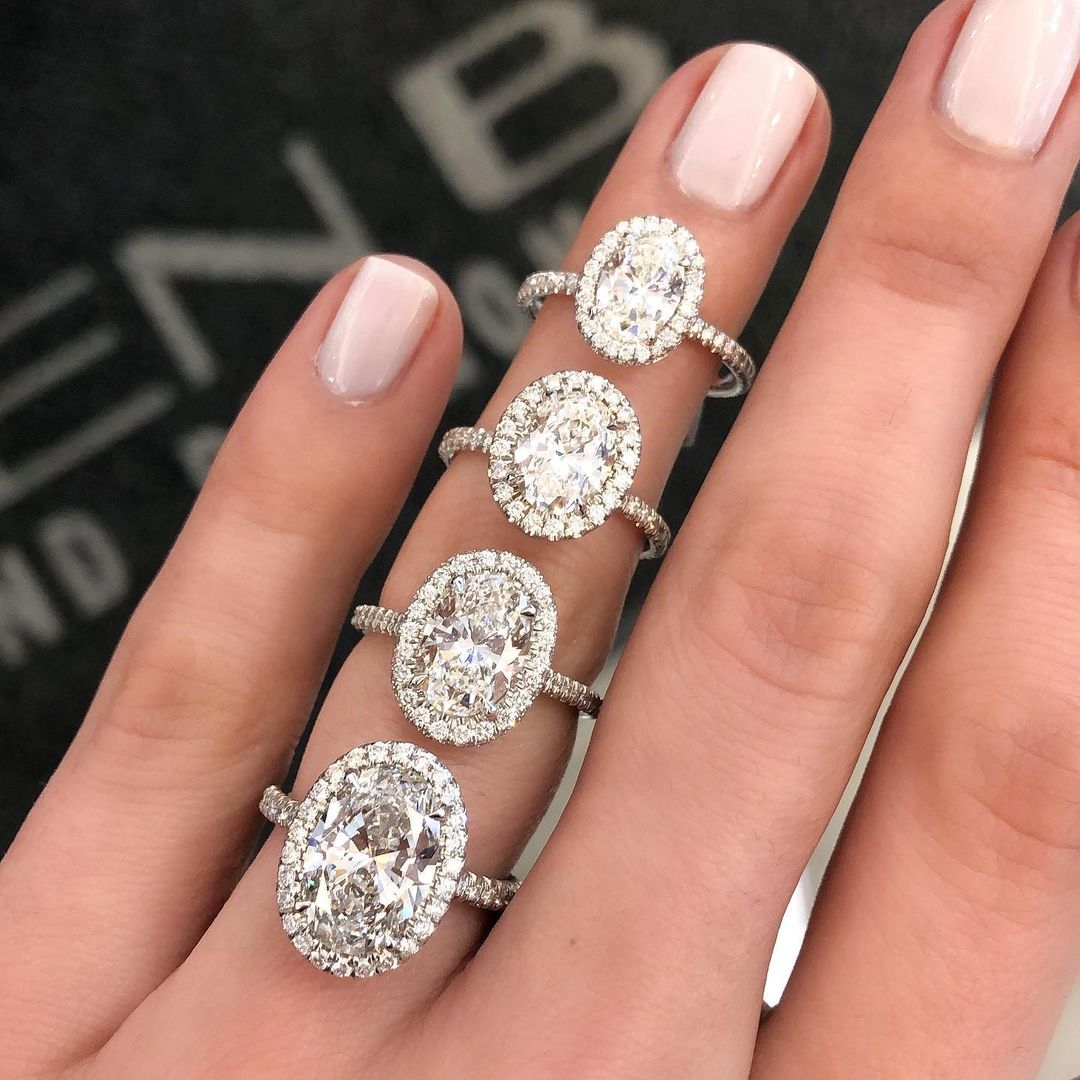 Stack of four oval halo engagement rings