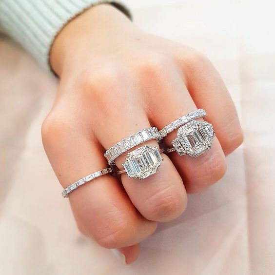 three-stone engagement rings on fist