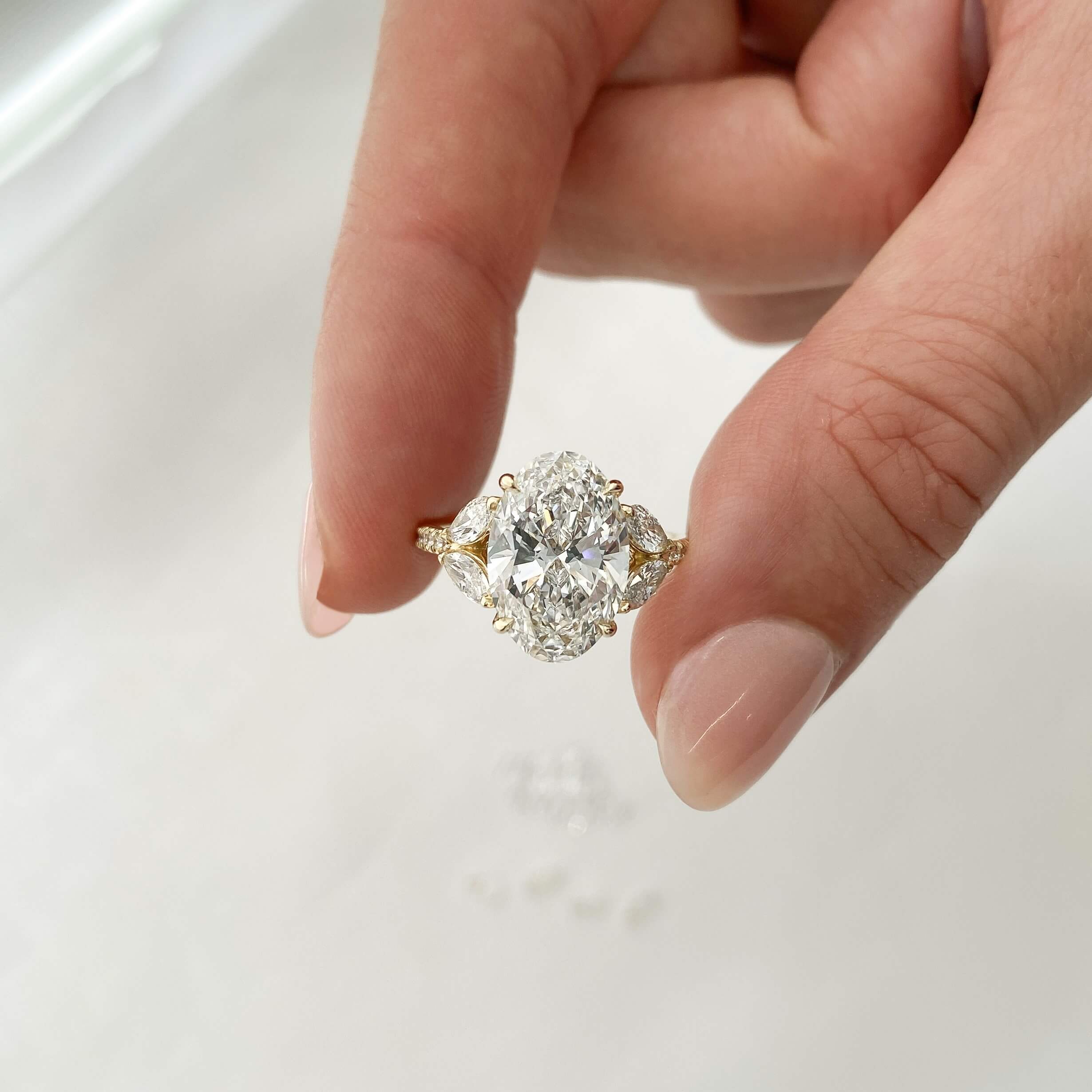 close-up view oval diamond engagement ring